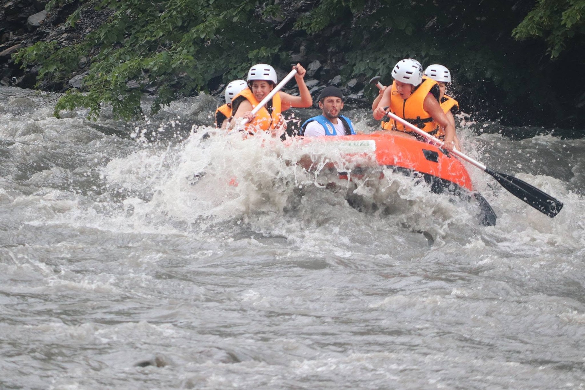 Rafting team hitting a big whitewater wave on the Aragvi river near Pasanauri